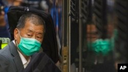 FILE - Democracy advocate Jimmy Lai leaves Hong Kong's Court of Final Appeal where the government is arguing against allowing him bail in Hong Kong, Feb. 1, 2021. 