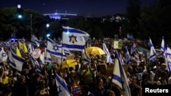 Anti-government protesters mark nine months since the deadly October 7 attack, under the slogan "Israel comes to a standstill", outside Israeli Prime Minister Benjamin Netanyahu's private residence in Jerusalem, July 7, 2024.