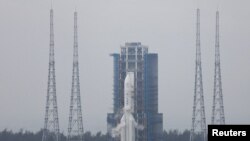 FILE PHOTO: The Chang'e 6 lunar probe and the Long March-5 Y8 carrier rocket combination sit atop the launch pad at the Wenchang Space Launch Site in Hainan province