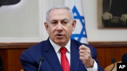 FILE - Israeli Prime Minister Benjamin Netanyahu chairs the weekly cabinet meeting in Jerusalem, April 14, 2019.