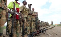 Jubbaland forces stand with their ammunitions as they prepare for a security patrol against Islamist al Shabaab militants in Bulagaduud town, north of Kismayo, Somalia, Aug. 17, 2015.