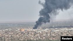 Drone footage shows dense smoke rising from fires near capital Khartoum