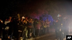 FILE - Demonstrators gathered at Floyd Light City Park, Aug. 6, 2020 in Portland, Ore. Protests turned violent again even after the mayor pleaded with demonstrators to stay off the streets.