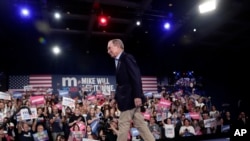 Democratic presidential candidate former New York City Mayor Mike Bloomberg walks off stage after speaking during a rally, Tuesday, March 3, 2020, in West Palm Beach, Fla.