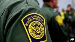 FILE - Border Patrol agents hold news conference prior to a media tour of a new U.S. Customs and Border Protection temporary facility in Donna, Texas, May 2, 2019.