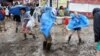 Jazz Fest's Last Day Finishes Soggy, but Strong