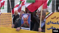 Iranian American protesters chant "Death to Khamenei" and "Death to Rouhani" as Iran's foreign minister Mohammad Javad Zarif appears at the Council on Foreign Relations in New York, April 23, 2018.