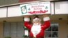 The post office in Santa Claus, Indiana, where Christmas carols are heard 12 months a year at the town hall, and many residents leave holiday decorations up all year. (santaclausind.org) 