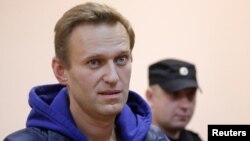 Russian opposition leader Alexei Navalny, who was detained over allegations of staging illegal protests, attends a court hearing in Moscow, Russia, Sept. 24, 2018. 