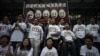 Protesters stand under a banner as they prepare to go on a hunger strike to call for &quot;true&quot; universal suffrage in Hong Kong, March 28, 2014.
