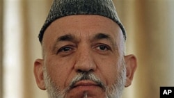 Afghan President Hamid Karzai listens during a press conference in Kabul, Afghanistan, 25 Oct 2010