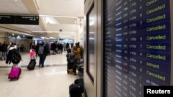 FILE - Flight cancellations mount during a cold weather front as a weather phenomenon known as a bomb cyclone hits the Upper Midwest, at Midway International Airport in Chicago, Illinois, Dec. 22, 2022. 