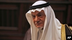 FILE - Saudi Prince Turki al-Faisal talks to the Associated Press in Abu Dhabi, United Arab Emirates, Nov. 24, 2018.