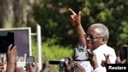 FILE - Uganda's former Prime Minister Amama Mbabazi, now a presidential candidate, speaks to the media at a gathering in Jinja town in eastern Uganda, Sept. 10, 2015. Mbabazi has accused the electoral commission of being one-sided and partisan.