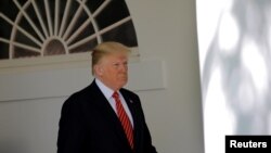 FILE - President Donald Trump is seen during a ceremony in the Rose Garden of the White House in Washington, May 1, 2018. 