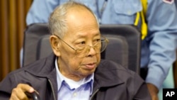 In this Nov. 23, 2011 file photo released by the Extraordinary Chambers in the Courts of Cambodia, former Khmer Rouge Foreign Minister Ieng Sary sits during the third day of a trial of the U.N.-backed war crimes tribunal in Phnom Penh, Cambodia.