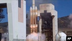 In this photo released by United Launch Alliance, a classified satellite for the U.S. National Reconnaissance Office is launched into orbit aboard a United Launch Alliance Delta 4 Heavy rocket on Sept. 24, 2022, at Vandenberg Space Force Base in California's Santa Barbara County.