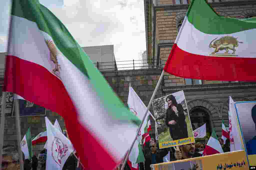 People protest outside the Swedish Parliament in Stockholm, Sweden, on Sept. 24, 2022
