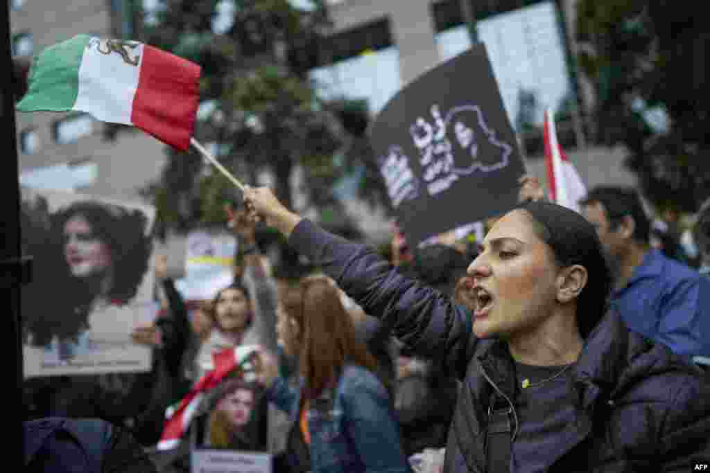 People demonstrate against the Iranian regime during a protest at Mel Lastman Square in Toronto, Ontario, Sept. 24, 2022.
