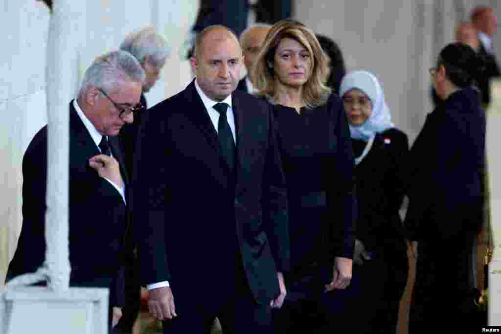 President of Bulgaria Rumen Radev and his wife Desislava Radeva pay their respects to Queen Elizabeth II&#39;s flag-draped coffin lying in state on the catafalque at Westminster Hall, Sept. 18, 2022 in London.