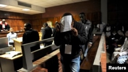 Protesters hold banners reading &quot;Freedom Political Prisoners, We are Republic&quot; as they gather in Sant Jaume square at a demonstration during a partial regional strike in Barcelona, Spain.