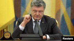FILE - Ukrainian President Petro Poroshenko speaks during a meeting of the country's Security and Defence Council in Kyiv, May 2, 2018. (Ukrainian Presidential Press Service)