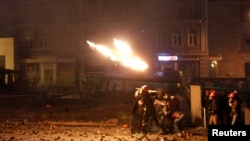 Pro-European protesters throw petrol bombs during clashes with Ukranian riot police in Kyiv, Jan. 20, 2014.