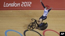 Britain's Jason Kenny celebrates after winning the gold medal in the track cycling men's sprint event, during the 2012 Summer Olympics in London, Monday, Aug. 6, 2012.