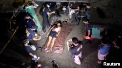 The body of a man whom police said was killed during a drug bust operation on "Shabu" (Meth), is seen in Manila, Philippines, Aug. 18, 2016.