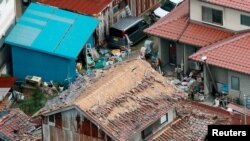 Houses damaged by an earthquake are seen in Kurayoshi, Tottori prefecture, Japan in this photo released by Kyoto, Oct. 21, 2016.