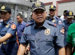 FILE - Then-Philippine National Police Chief Ronald dela Rosa walks after an anti-terror simulation exercise at a bus terminal in Quezon city, north of Manila, Philippines, Apr. 11, 2017.