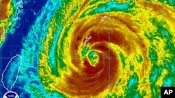 A weather satellite image obtained from the National Oceanic and Atmospheric Administration shows Typhoon Muifa near Okinawa, Japan at 1130 GMT on August 4, 2011