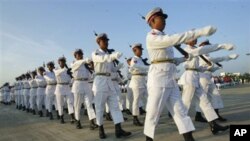 Guard of Honor march in front of city hall to participate in a ceremony to mark 63rd anniversary of Independence Day, Jan. 4, 2011, in Naypyitaw, Burma.