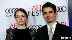 Director Damien Chazelle and cast member Emma Stone pose at the premiere of "La La Land" during AFI FEST in Hollywood, Calif., Nov. 15, 2016. 