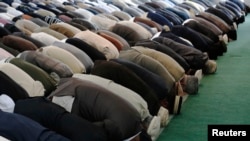 Men pray at a mosque in south London, September 2012. 