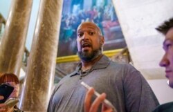 Harry Dunn, a U.S. Capitol Police officer who faced rioters on Jan. 6, talks to reporters as he leaves a meeting with House Minority Leader Kevin McCarthy, R-Calif., at the Capitol in Washington, June 25, 2021.