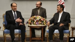 Iraqi Prime Minister Nouri al-Maliki, left, speaks with Iranian President Mahmoud Ahmadinejad, right, during their meeting in Tehran, Iran. Iran gave its clearest nod of support to Iraq's prime minister Monday as he seeks to line up backing from key neigh