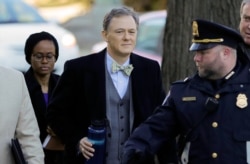 Career Foreign Service officer George Kent, center in bowtie, arrives to testify before the House Intelligence Committee on Capitol Hill in Washington, Wednesday, Nov. 13, 2019, during the first public impeachment hearings of President Donald Trump…
