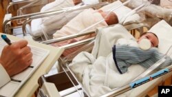 FILE - Newborn babies fill the nursery of a postpartum recovery center in upstate New York, Feb. 16, 2017. According to a Centers for Disease Control and Prevention report released May 17, 2018, 2017 saw the lowest number of U.S. births in 30 years.
