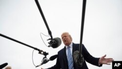 President Donald Trump speaks to the press before boarding Air Force One in Andrews Air Force Base, Md., March 28, 2020.