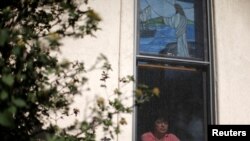 FILE - Immigrant Rosa Sabido, who lives in sanctuary in the United Methodist Church while facing deportation, poses for a portrait in Mancos, Colorado, July 19, 2017.