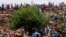 FILE - Miners gather on a hill during their strike at the AngloGold Ashanti Mine in Fochville near Johannesburg, South Africa, Oct. 19, 2012.