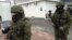 Unidentified gunmen on patrol at Simferopol Airport in Ukraine's Crimea peninsula, Feb. 28, 2014 (Elizabeth Arrott/VOA) 