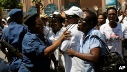 A group of over 250 women march through the center of Bujumbura, Burundi, calling for the release of protesters arrested during demonstrations, Sunday May 10, 2015. 