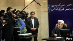Iran's President Hassan Rouhani, who is also a member of the Experts Assembly, speaks with the media in a press briefing after registering his candidacy for the Feb. 26 elections of the assembly at interior ministry in Tehran, Iran, Monday, Dec. 21, 2015.