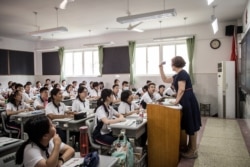 Students attend a class on the first day of the new semester in Wuhan in China's central Hubei province on Sept. 1, 2020.
