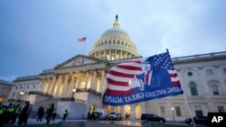 Trump supporters left a flag outside the Capitol, Jan. 6, 2021, in Washington.