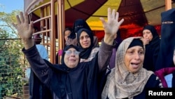 Mourners react during the funeral of Palestinians killed in Israeli strikes, amid the Israel-Hamas conflict, at Nasser hospital in Khan Younis in the southern Gaza Strip, Dec. 16, 2024. 
