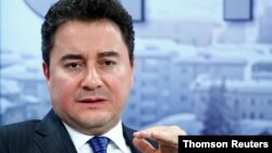 FILE - Former Turkish official Ali Babacan gestures during a meeting in Davos, Switzerland, July 11, 2019.