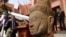 The head of Male Divinity statue is on display during a ceremony after the artifacts were returned back from Norwegian collector Morten Bosterud, at Cambodian National Museum in Phnom Penh, Cambodia, Tuesday, Oct. 20, 2015. Cambodia welcomed home two stone statue from golden Angkor era that was looted from a temple during the country's civil war and spent the past three decades in abroad. (AP Photo/Heng Sinith)